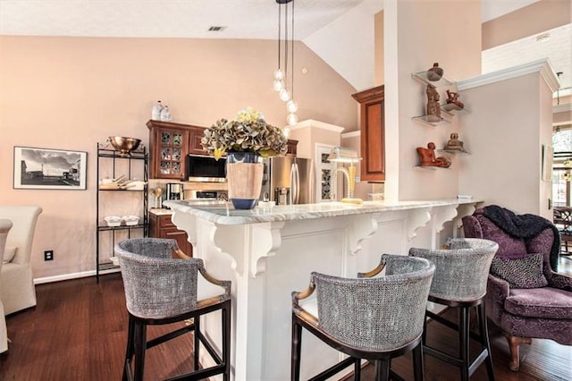 kitchen with a breakfast bar, high vaulted ceiling, kitchen peninsula, dark hardwood / wood-style flooring, and stainless steel fridge with ice dispenser