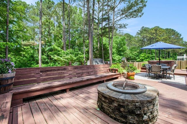 wooden terrace with a fire pit