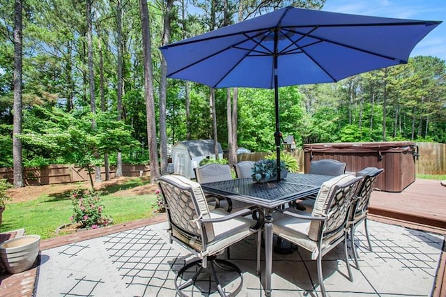 view of patio / terrace with a wooden deck and a hot tub