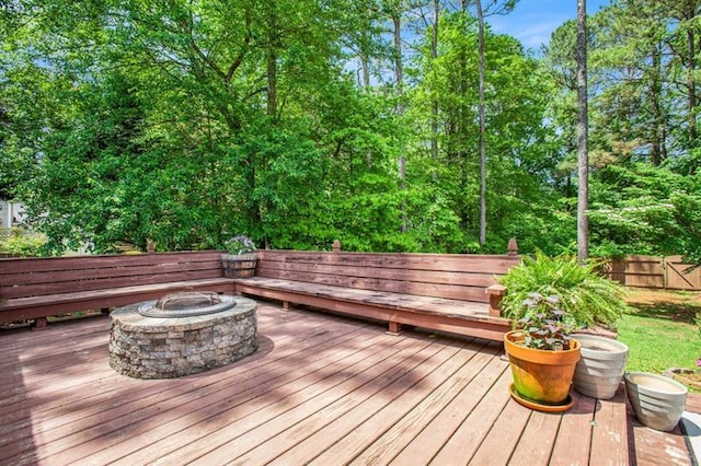 wooden deck with an outdoor fire pit