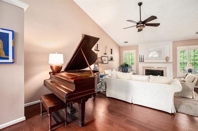 living room featuring high vaulted ceiling, ceiling fan, and dark wood-type flooring