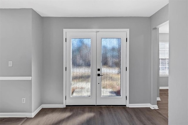 doorway with dark hardwood / wood-style floors and french doors