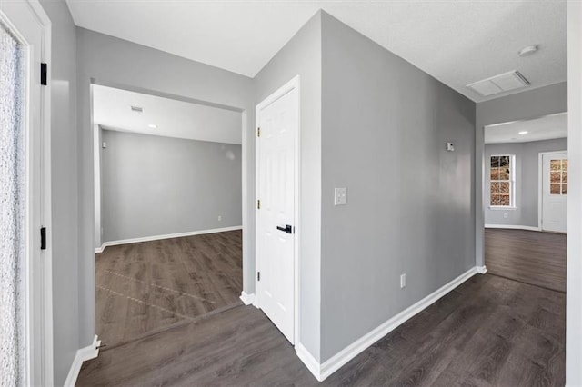 hallway featuring dark wood-type flooring