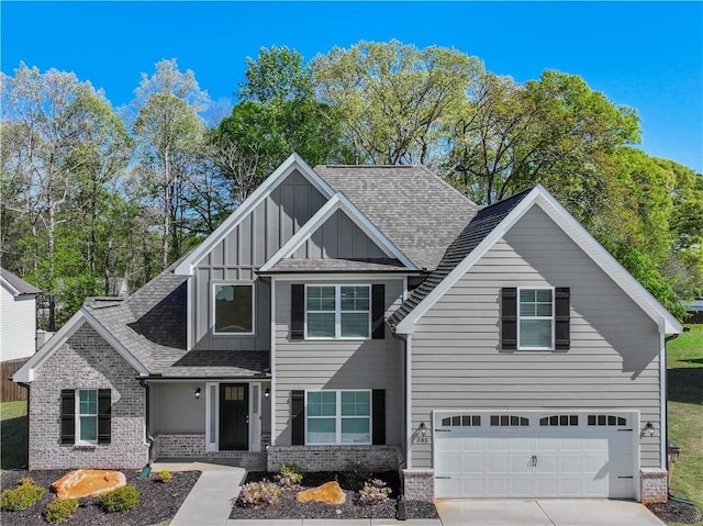 385 Finch Landing Rd, Winder, GA 30680 - craftsman inspired home featuring an attached garage, board and batten siding, brick siding, driveway, and roof with shingles