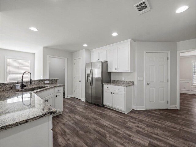 385 Finch Landing Rd, Winder, GA 30680 - kitchen featuring white cabinets, visible vents, stainless steel refrigerator with ice dispenser, a sink, and dark wood-style floors