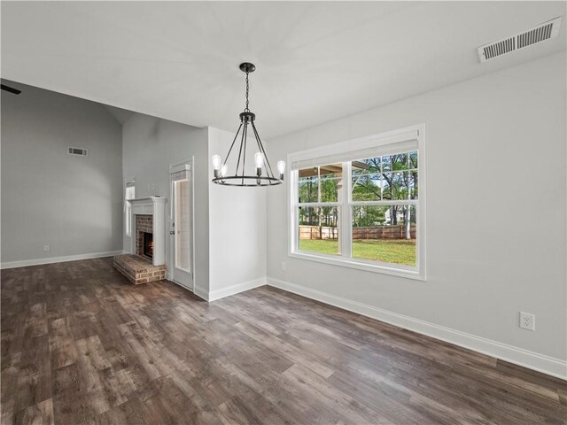 385 Finch Landing Rd, Winder, GA 30680 - unfurnished dining area with baseboards, a notable chandelier, dark wood finished floors, and visible vents