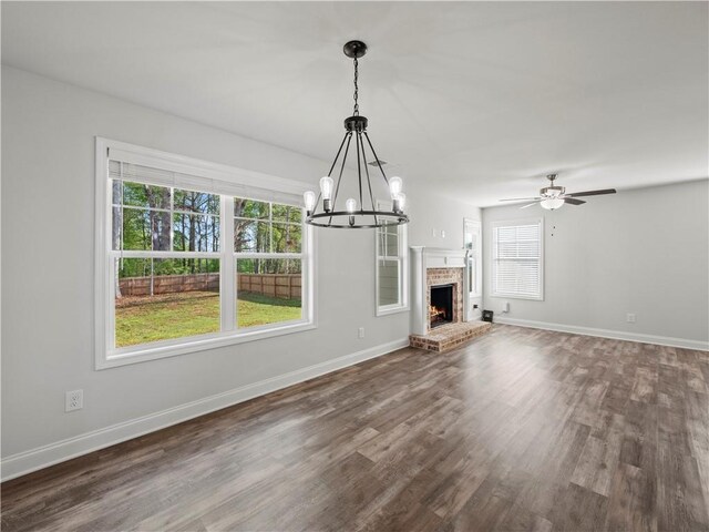385 Finch Landing Rd, Winder, GA 30680 - unfurnished living room with baseboards and dark wood finished floors