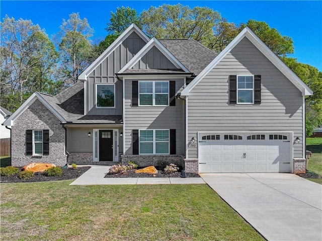 385 Finch Landing Rd, Winder, GA 30680 - craftsman-style home featuring driveway, board and batten siding, an attached garage, a front yard, and brick siding