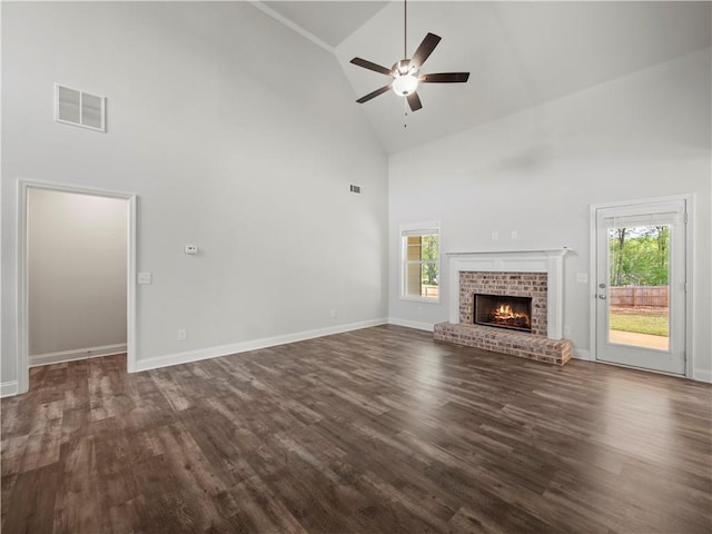 385 Finch Landing Rd, Winder, GA 30680 - unfurnished living room featuring high vaulted ceiling, dark wood-type flooring, visible vents, and ceiling fan