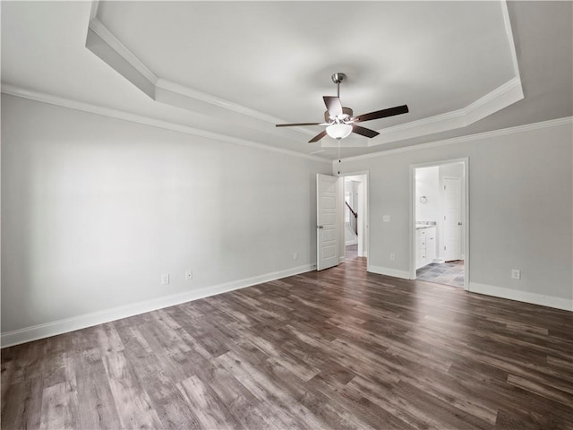 385 Finch Landing Rd, Winder, GA 30680 - unfurnished room featuring ceiling fan, dark wood-style flooring, ornamental molding, and a raised ceiling