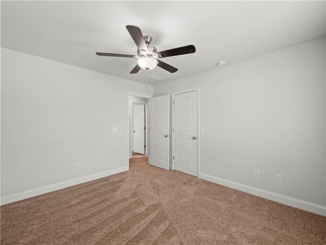 385 Finch Landing Rd, Winder, GA 30680 - unfurnished bedroom with baseboards, ceiling fan, and carpet