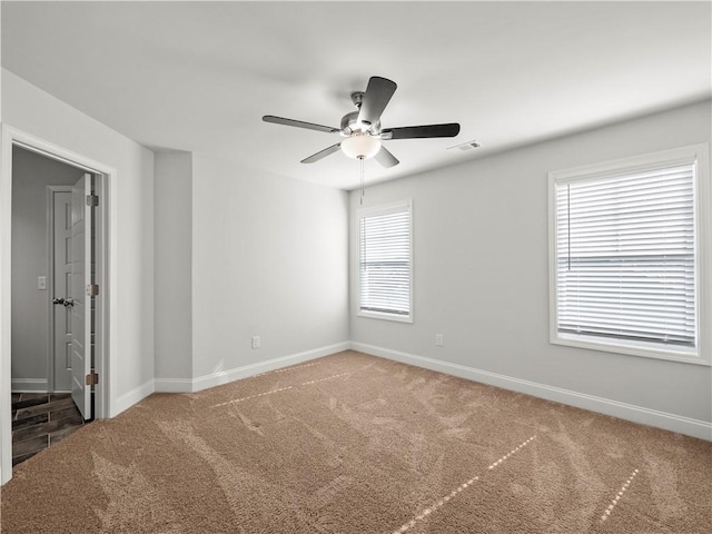 385 Finch Landing Rd, Winder, GA 30680 - carpeted spare room with visible vents, baseboards, and a ceiling fan