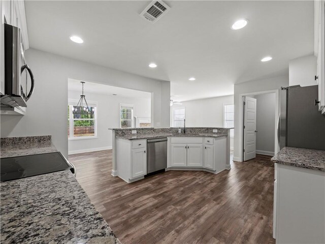 385 Finch Landing Rd, Winder, GA 30680 - kitchen featuring white cabinetry, visible vents, dark wood finished floors, stainless steel appliances, and a sink