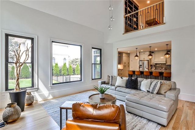 living room with a wealth of natural light and hardwood / wood-style flooring