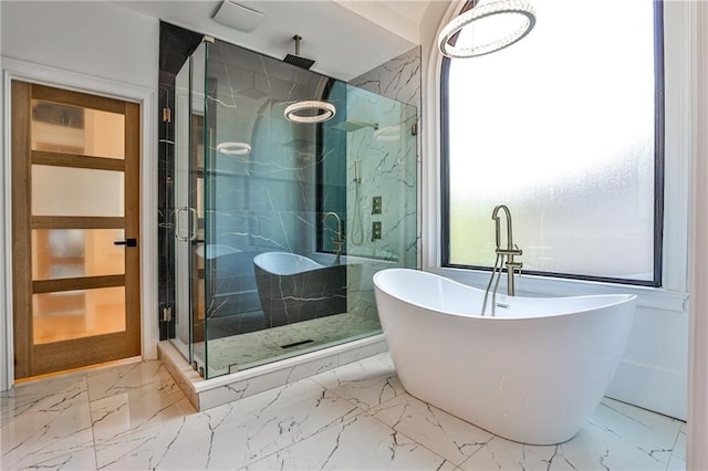 bathroom with separate shower and tub