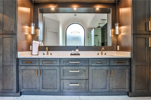 bathroom featuring a shower and vanity