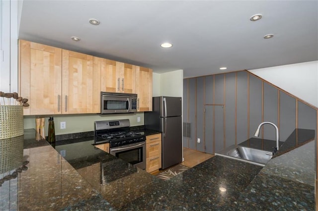kitchen with light brown cabinetry, recessed lighting, visible vents, a sink, and stainless steel appliances