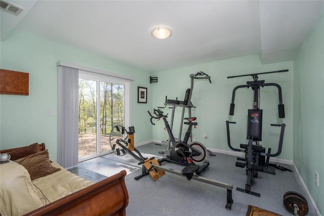 exercise area with baseboards and visible vents