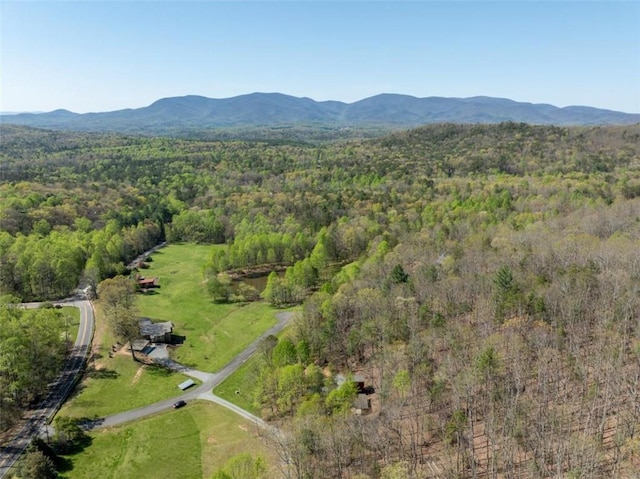 aerial view with a forest view and a mountain view