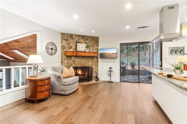 sitting room with light hardwood / wood-style flooring and a fireplace