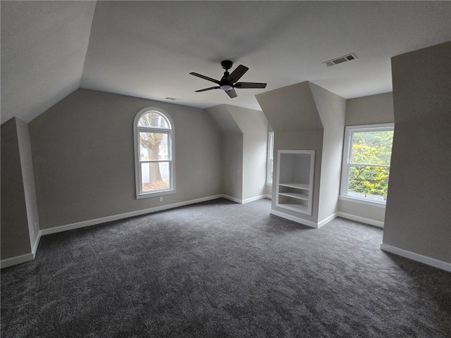 7910 Tintern Trce, Duluth, GA 30097 - bonus room with visible vents, plenty of natural light, dark carpet, and vaulted ceiling