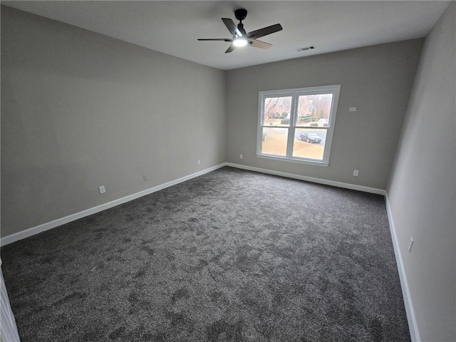 7910 Tintern Trce, Duluth, GA 30097 - spare room featuring baseboards, a ceiling fan, dark colored carpet, and visible vents
