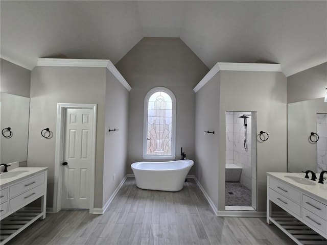 7910 Tintern Trce, Duluth, GA 30097 - bathroom with a shower stall, two vanities, a sink, and wood finished floors