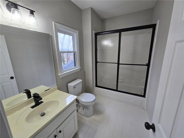 7910 Tintern Trce, Duluth, GA 30097 - bathroom featuring vanity, enclosed tub / shower combo, tile patterned floors, and toilet