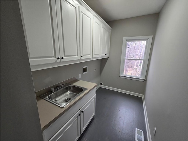 7910 Tintern Trce, Duluth, GA 30097 - washroom featuring cabinet space, washer hookup, a sink, baseboards, and visible vents
