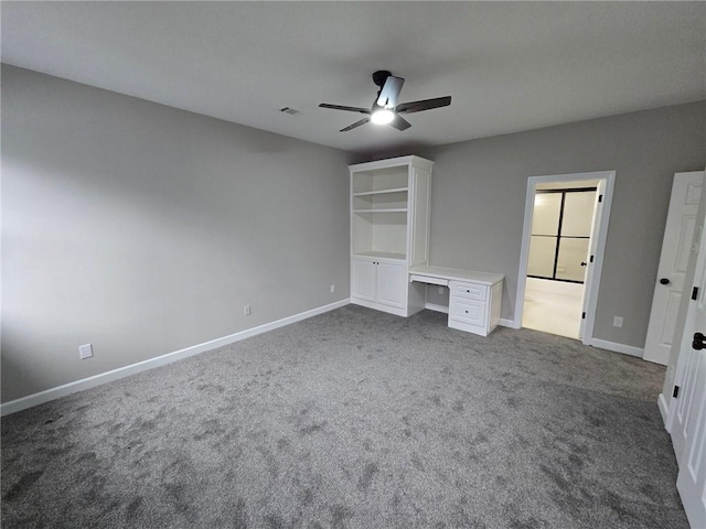7910 Tintern Trce, Duluth, GA 30097 - unfurnished bedroom featuring baseboards, ceiling fan, and dark carpet