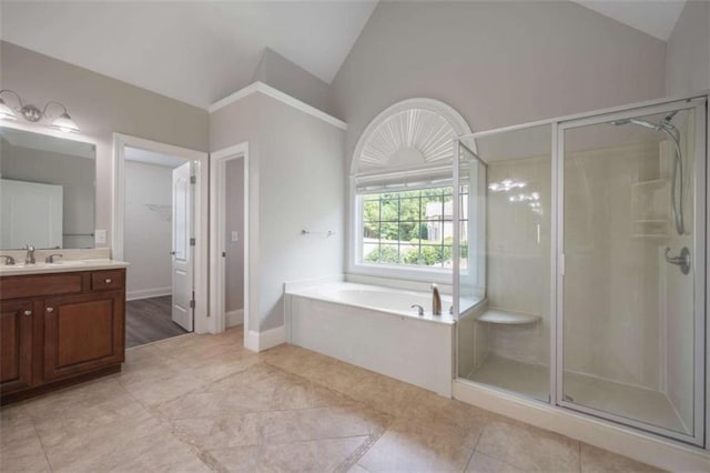 5737 Russell Ct, Douglasville, GA 30135 - bathroom featuring a stall shower, vanity, and vaulted ceiling