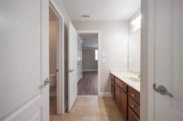 5737 Russell Ct, Douglasville, GA 30135 - bathroom with vanity, visible vents, toilet, tile patterned floors, and baseboards