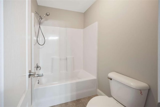 5737 Russell Ct, Douglasville, GA 30135 - full bath featuring toilet, tile patterned floors, shower / tub combination, and baseboards