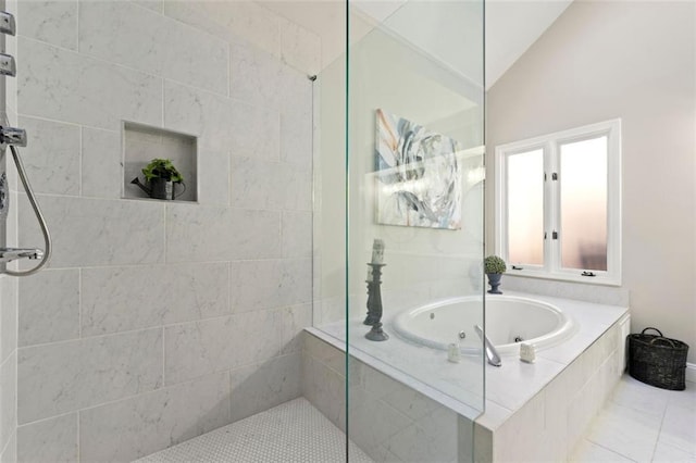 full bathroom with vaulted ceiling, a jetted tub, and a walk in shower