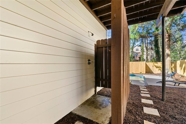 view of patio featuring fence and a fenced in pool