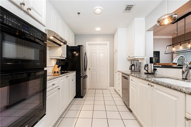 211 Colonial Homes Dr NW Unit 2501, Atlanta, GA 30309 - kitchen with black appliances, a sink, wall chimney range hood, white cabinetry, and recessed lighting