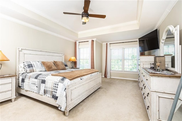 211 Colonial Homes Dr NW Unit 2501, Atlanta, GA 30309 - bedroom with light colored carpet, crown molding, a tray ceiling, baseboards, and ceiling fan