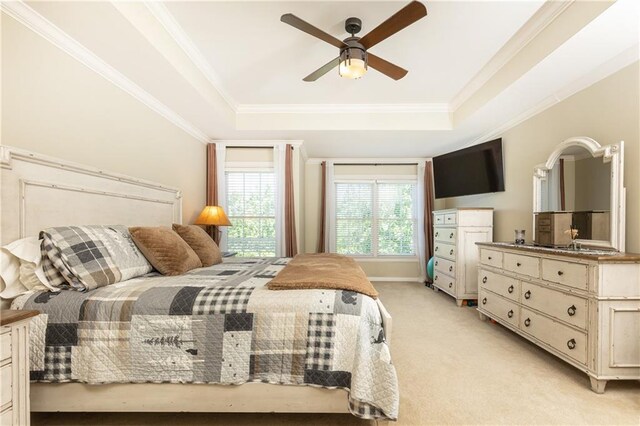 211 Colonial Homes Dr NW Unit 2501, Atlanta, GA 30309 - bedroom with light carpet, a tray ceiling, crown molding, a ceiling fan, and baseboards