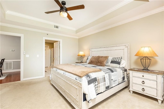 211 Colonial Homes Dr NW Unit 2501, Atlanta, GA 30309 - bedroom with a tray ceiling, ornamental molding, light colored carpet, baseboards, and a ceiling fan