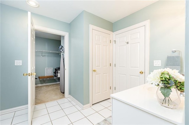 211 Colonial Homes Dr NW Unit 2501, Atlanta, GA 30309 - bathroom with baseboards, vanity, and tile patterned floors