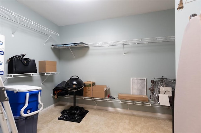 211 Colonial Homes Dr NW Unit 2501, Atlanta, GA 30309 - walk in closet featuring carpet floors