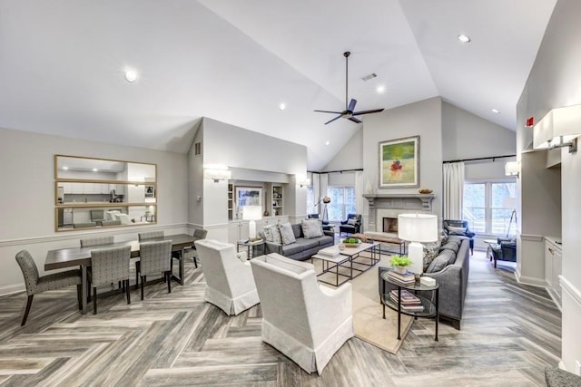 211 Colonial Homes Dr NW Unit 2501, Atlanta, GA 30309 - living room featuring high vaulted ceiling, a ceiling fan, a fireplace, recessed lighting, and baseboards