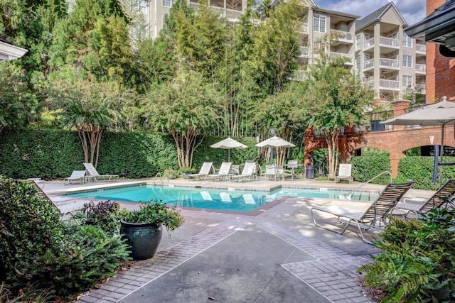 211 Colonial Homes Dr NW Unit 2501, Atlanta, GA 30309 - community pool featuring a patio area