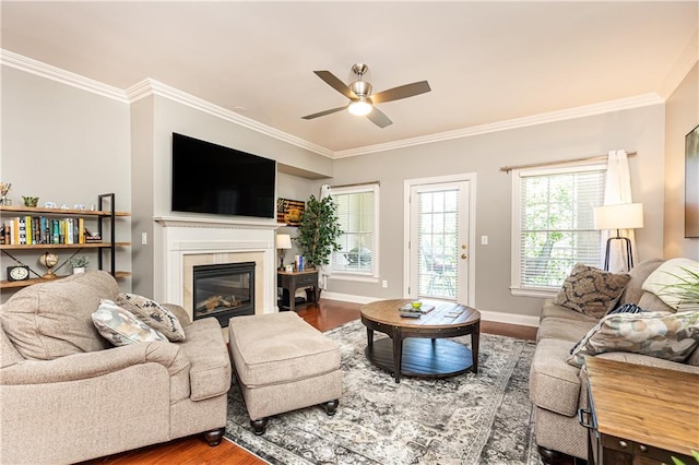 211 Colonial Homes Dr NW Unit 2501, Atlanta, GA 30309 - living room with ornamental molding, ceiling fan, wood finished floors, a glass covered fireplace, and baseboards