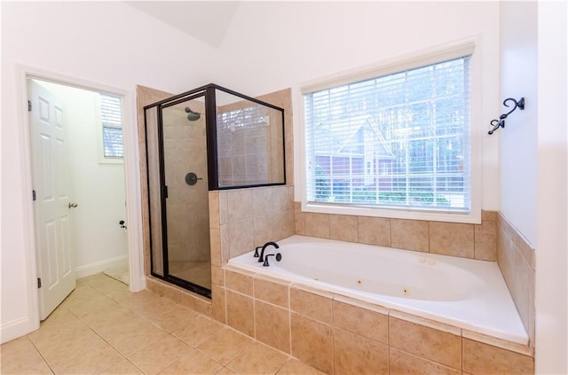 bathroom featuring a stall shower, plenty of natural light, a tub with jets, and tile patterned floors