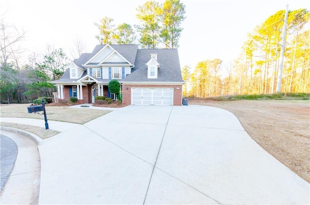 view of front of property with brick siding, driveway, and an attached garage