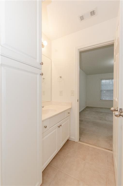 bathroom featuring tile patterned flooring, visible vents, and vanity