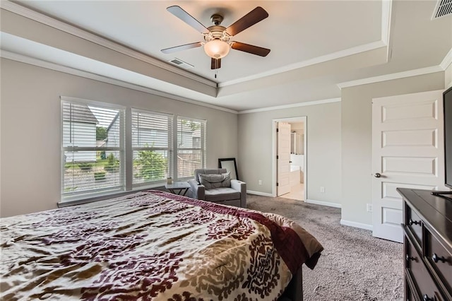 2486 Bear Mountain St, Lithonia, GA 30058 - carpeted bedroom featuring a raised ceiling, ornamental molding, connected bathroom, and a ceiling fan