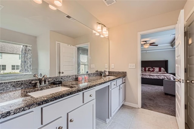 2486 Bear Mountain St, Lithonia, GA 30058 - ensuite bathroom featuring double vanity, ceiling fan, and tile patterned floors
