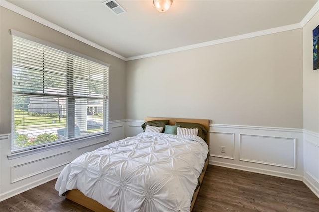 2486 Bear Mountain St, Lithonia, GA 30058 - bedroom featuring wood finished floors, crown molding, wainscoting, and a decorative wall